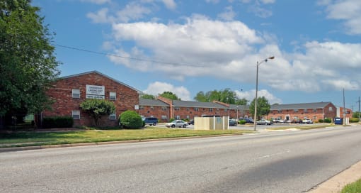 a large brick building on the side of a street