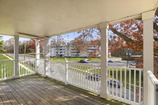 a porch with a view of a parking lot