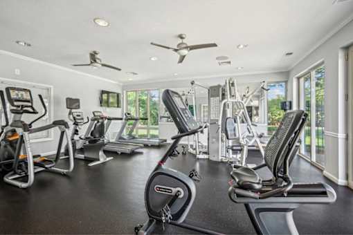 A spacious home gym with a variety of exercise equipment.