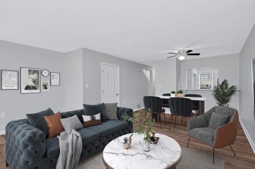 a living room with gray walls and a white marble coffee table