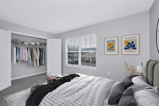 a bedroom with a large bed and a walk in closet