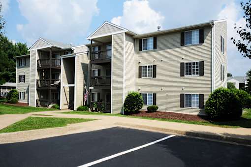 Apartment building with a flag on the balcony.