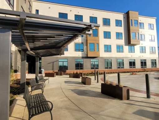 Outdoor seating area at the front of apartment building-Beecher Terrace I, Louisville, KY