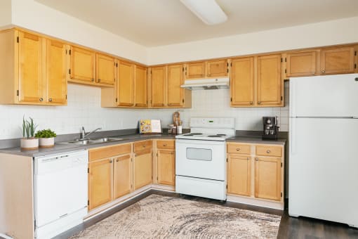 Staged apartment kitchen-Horace Mann Apartments
