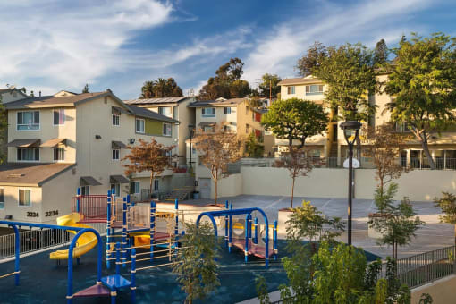 Playground and apartment buildings at Mission Plaza Apartments, Los Angeles, CA