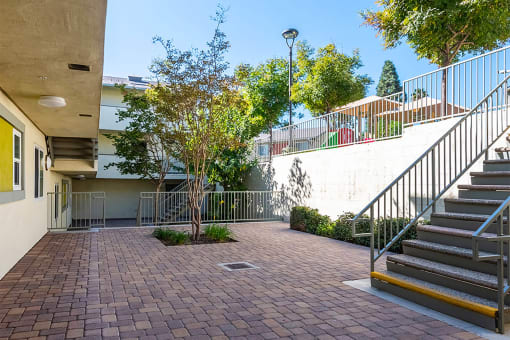 Outdoor breezeway area at Mission Plaza Apartments, Los Angeles, CA