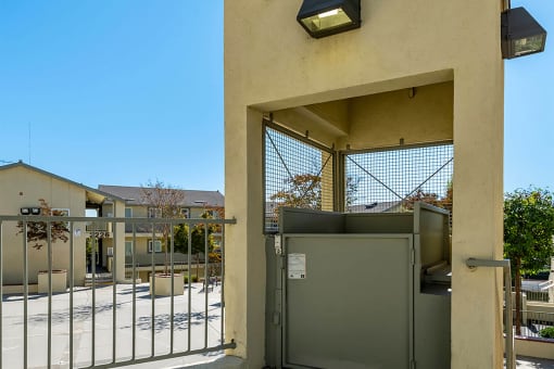 Exterior elevator entrance at Mission Plaza Apartments, Los Angeles, CA