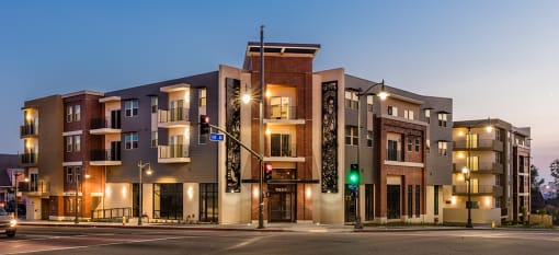 Santa Cecilia Apartment building on a city street with a traffic light