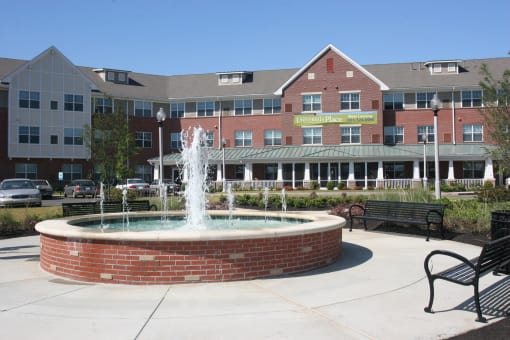 Apartment building and fountain-Senior Living at University Place Apartments, Memphis, TN 38104
