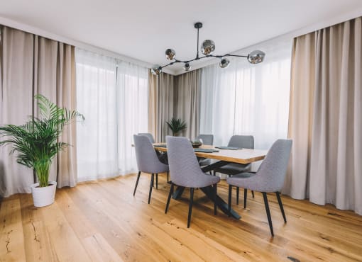 Dining room with wooden table and wooden floor