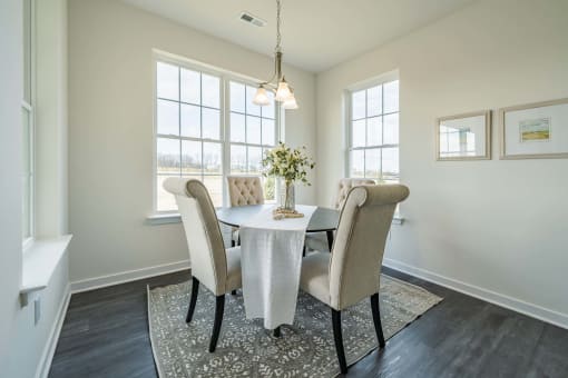 Dining area with large windows and natural sunlight