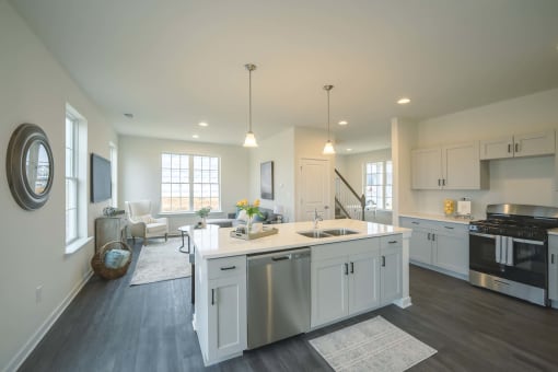 Open layout with kitchen and living room and large windows