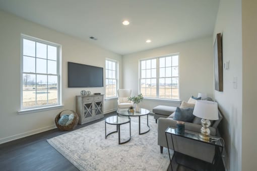 Living room with large windows and natural night