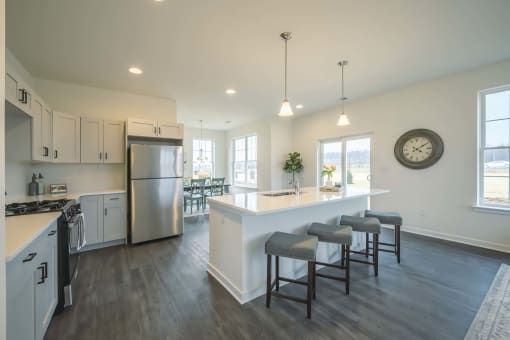Kitchen with stove, refrigerator and island