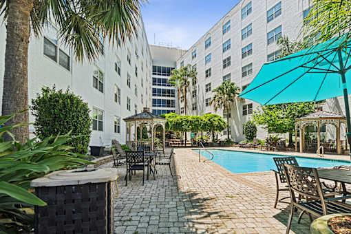 Pool surrounded with table and chairs at Esplanade at City Park, Louisiana, 70119