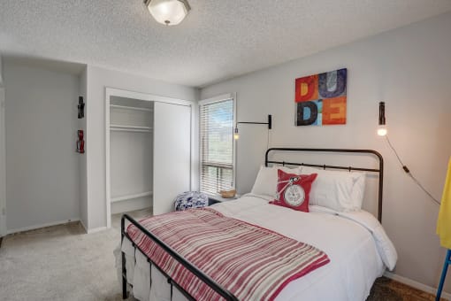 Bedroom with a bed, window and closet at Governor's Park, Fort Collins, 80525
