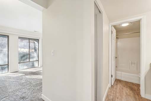 A room with a carpeted floor and a doorway leading to another room. at Cliffs at Canyon Ridge, Utah, 84401