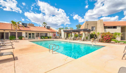 a swimming pool with a house in the background at Murietta at ASU, Arizona