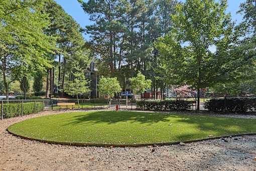 A park with a green lawn at Canopy Glen, Norcross