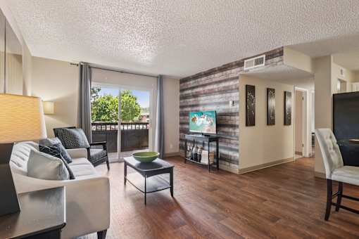 Living Room With Balcony at University Village Apartments, Colorado Springs, CO
