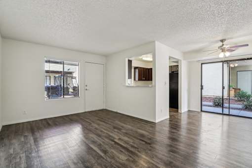 A room with wooden floors and white walls at Del Coronado Apartment , Arizona