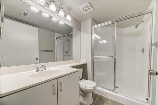 Bathroom with walk in shower, toilet and sink at Pembroke Pines Landings, Pembroke Pines, FL, 33025