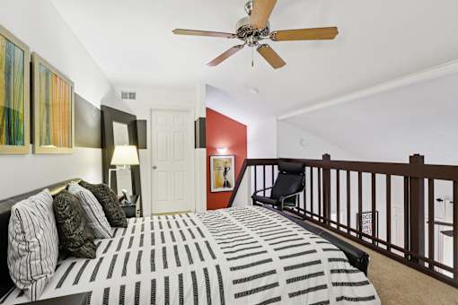 Bedroom with bed and cushions at Whisper Lake Apartments, Florida,32792
