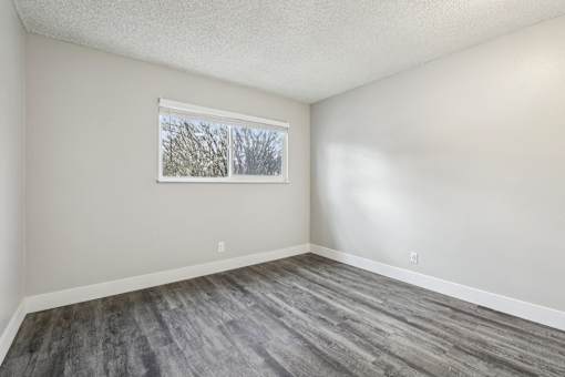 A room with a window and a grey floor at Spyglass Creek, Denver, 80224