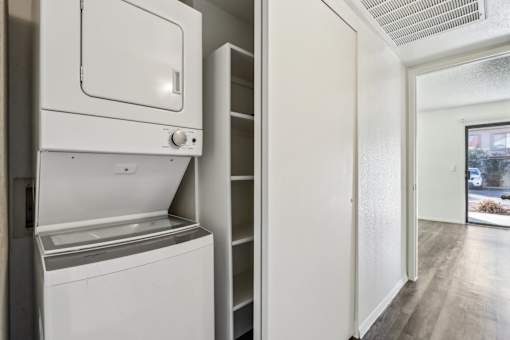 A white dishwasher and oven in a kitchen at Del Coronado Apartment , Mesa