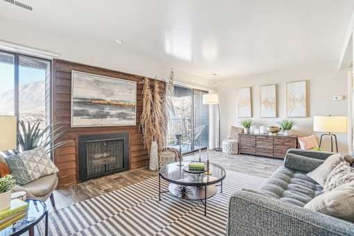 A living room with a fireplace and a painting on the wall. at Cliffs at Canyon Ridge, Utah, 84401