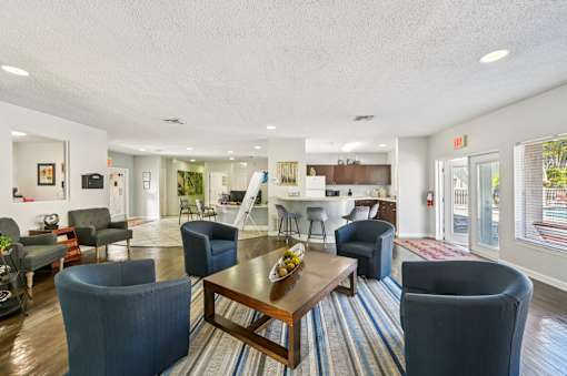 A living room with a dining table and chairs. at Sarasota South Apartments, Bradenton, 34207