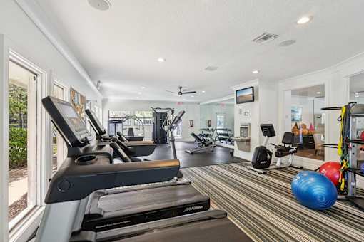 A gym with treadmills, exercise balls, and other equipment. at Lakeside Glen Apartments, Melbourne, FL, 32904