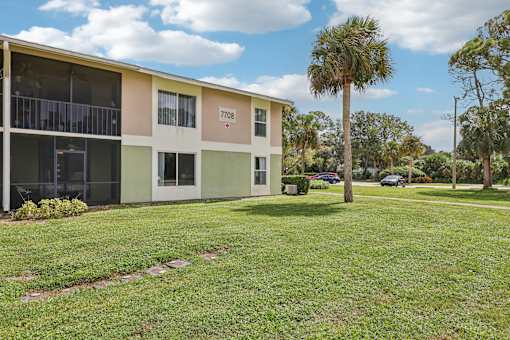 A building with the number 7708 on it. at Lakeside Glen Apartments, Florida, 32904