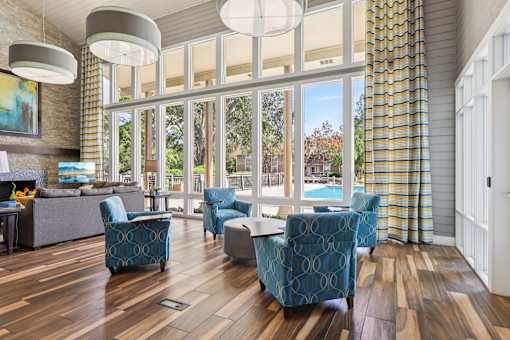 Living room with fireplace at Whisper Lake Apartments, Winter Park, FL, 32792