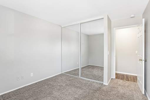 A room with white walls and a carpeted floor. at Millennium at Creve Coeur, Missouri
