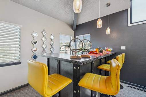 A kitchen with a table and chairs at Union Heights Apartments, Colorado Springs, Colorado