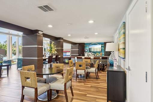 Dining room with a table surrounded by chairs at Whisper Lake Apartments, Winter Park, 32792