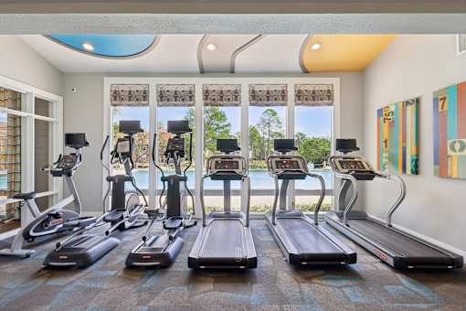 Row of treadmills in fitness center at Whisper Lake Apartments, Winter Park, 32792