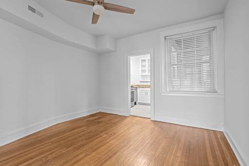 A room with a wooden floor and a ceiling fan.at The Collection of Historic Richmond, Virginia, 23220