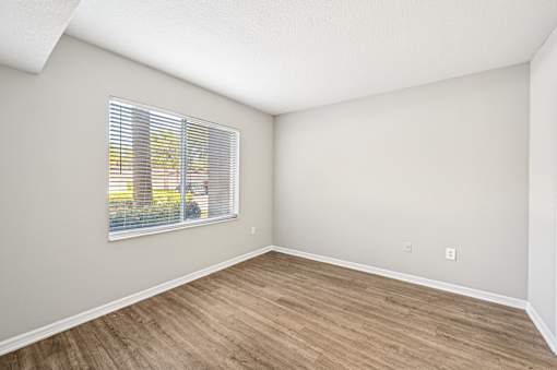 A room with a window and wooden flooring. at Heritage Bay, Florida