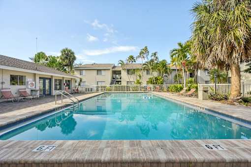 A swimming pool with the number 6F painted on the side. at Sarasota South Apartments, Bradenton, FL, 34207