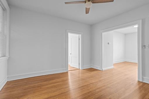 A room with a ceiling fan and wooden floors.at The Collection of Historic Richmond, Richmond, VA