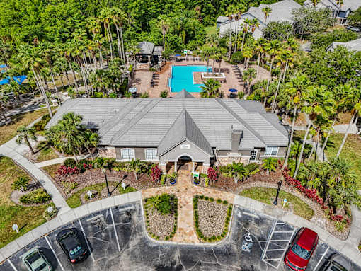 A large house with a pool in the backyard at The Parkway at Hunters Creek, Orlando, 32837