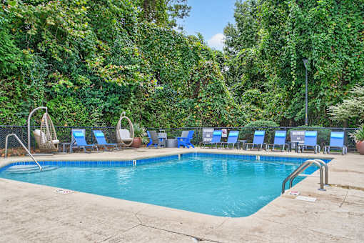 Pool With Relaxing Chairs at Lofts of Wilmington, North Carolina, 28405