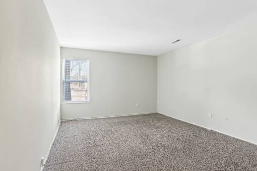 Empty room with carpeted floor and a window. at Millennium at Creve Coeur, Creve Coeur