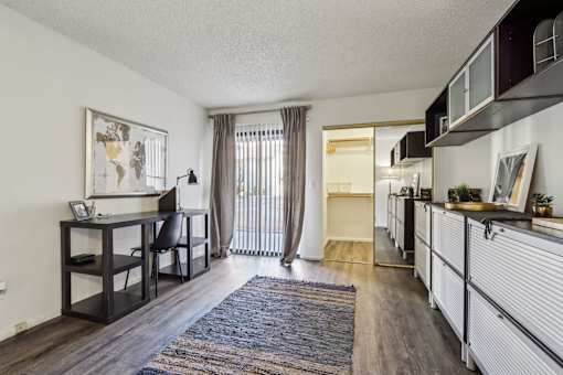 A room with a desk and a chair in it at Del Coronado Apartment , Mesa