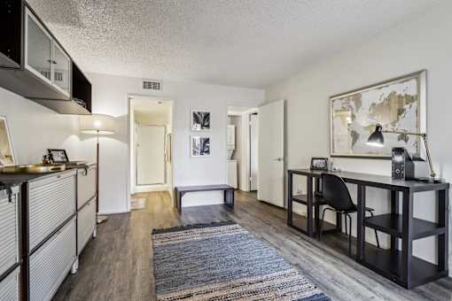 A room with a desk and a chair in it at Del Coronado Apartment , Mesa, 85202