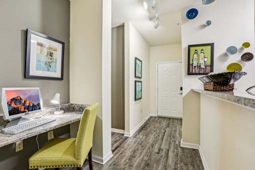 Home workspace nook with computer desk and entryway at The Arbor Walk Apartments, Tampa, FL