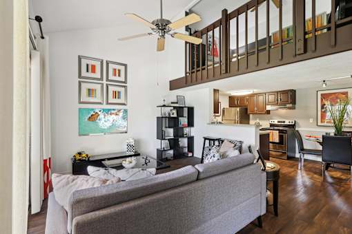 Living room with grey couch at Whisper Lake Apartments, Winter Park, 32792