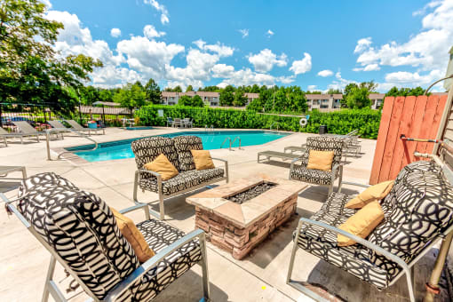 Pool area with chairs and a firepit  at Union Heights Apartments, Colorado Springs, CO